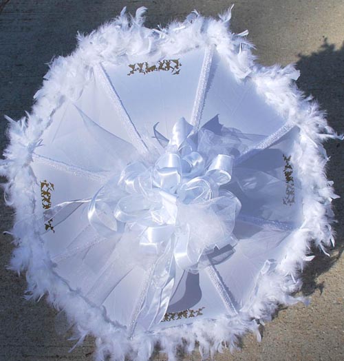 This is a simple and elegantly decorated white umbrella that adds class to